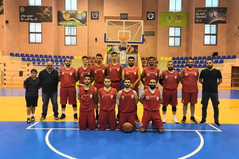 De La Salle basketball team assembled on an indoor court.